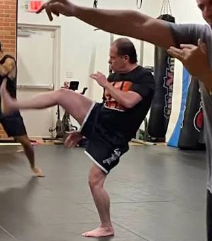 Sifu Steve Ventura on the floor demonstrating technique